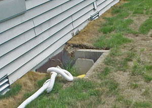 old concrete window well of a Scranton crawl space