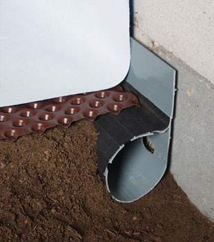 Closeup of a crawl space drainage system installed in Saylorsburg